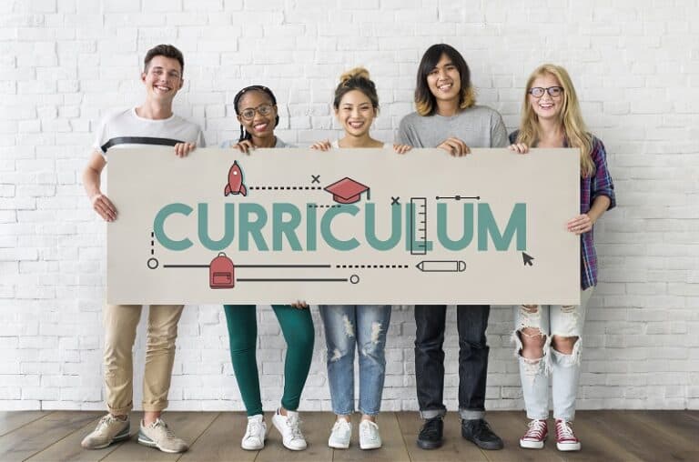 Why is The Education Hub looking at curriculum design and instructional materials?